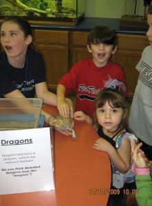 Dylan reluctantly pets the dragon. Hagrid would be proud.